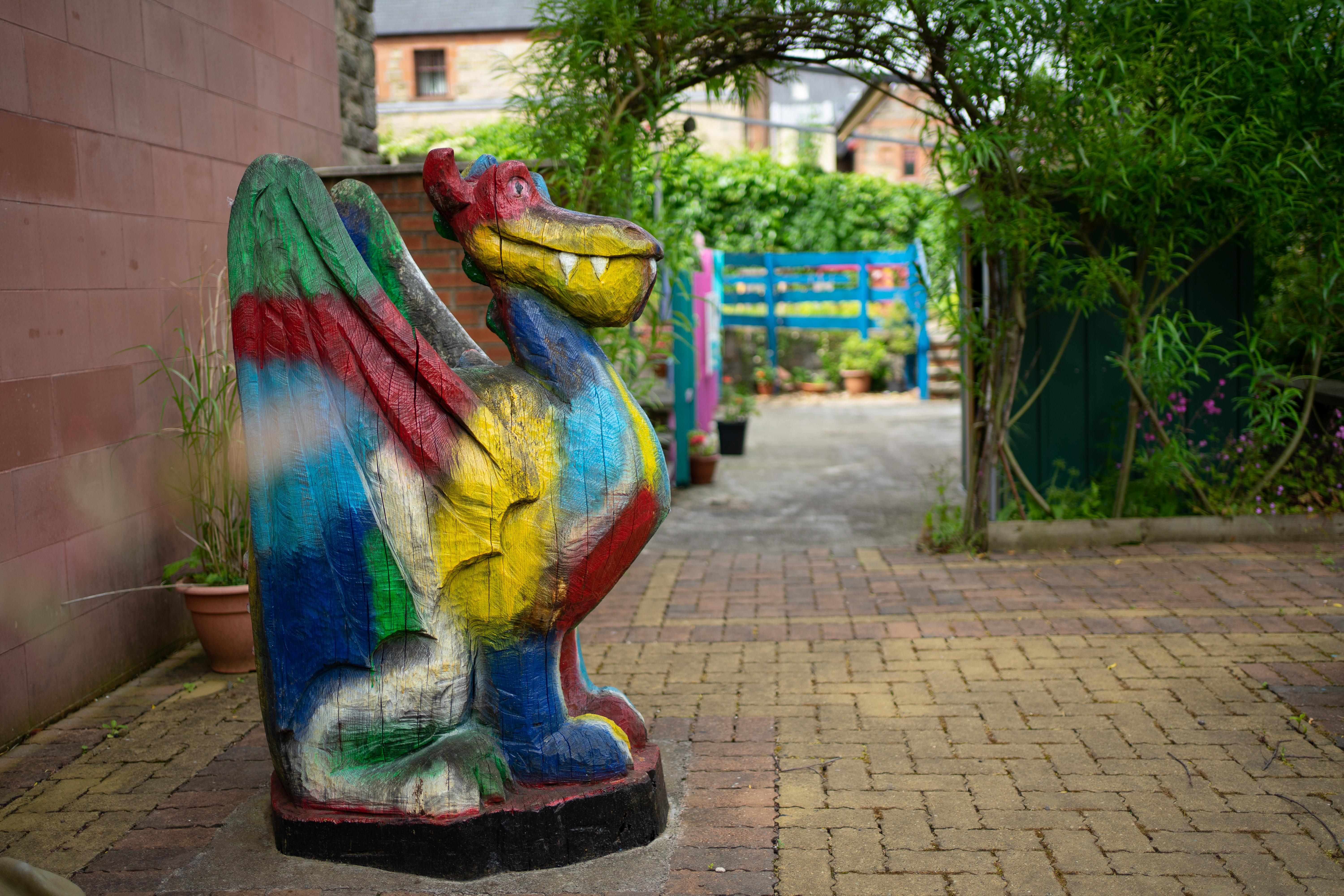 Colourful Wooden Dragon Statue in Community Garden